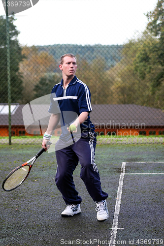 Image of Male playing Tennis