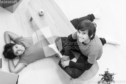 Image of boys with cardboard boxes around them top view