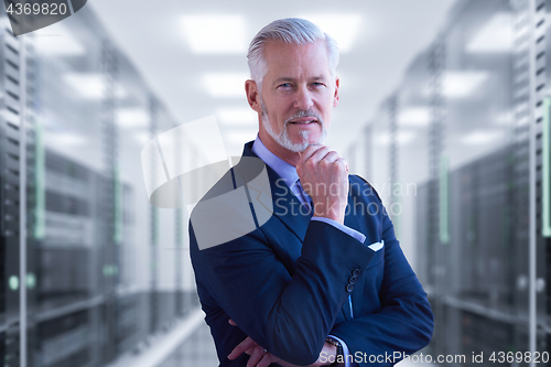 Image of Senior businessman in server room