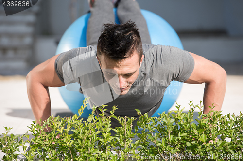 Image of man doing morning yoga exercises