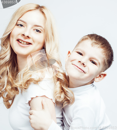 Image of young modern blond curly mother with cute son together happy smiling family posing cheerful on white background, lifestyle people concept, sister and brother friends
