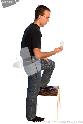 Image of Man Changing Lightbulb