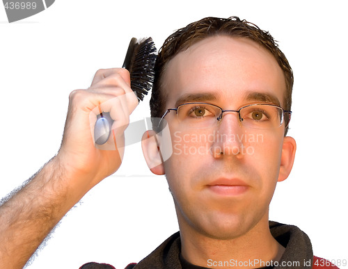 Image of Man Brushing His Hair