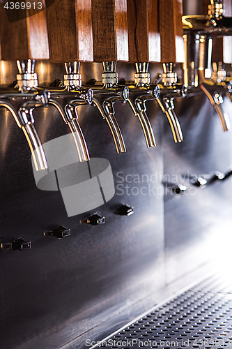 Image of Beer taps in a pub