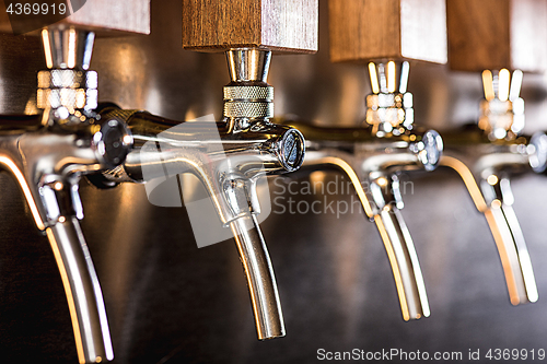 Image of Beer taps in a pub