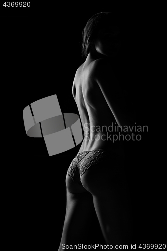 Image of Black and white silhouette of young, sporty and sexy woman in lingerie