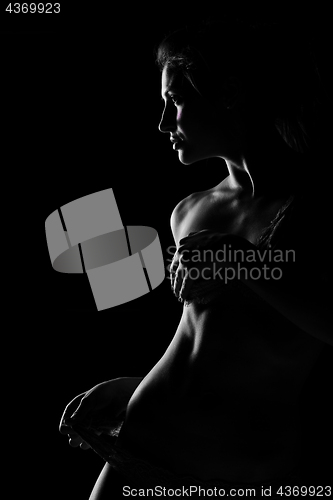 Image of Black and white silhouette of young, sporty and sexy woman in lingerie