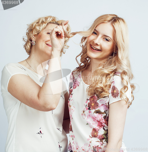 Image of mother with daughter together posing happy smiling isolated on white background with copyspace, lifestyle people concept 