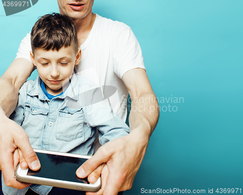 Image of young pretty man model with little cute son playing together, lifestyle modern people concept, family male 