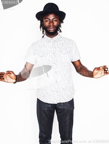 Image of young handsome afro american boy in stylish hipster hat gesturin