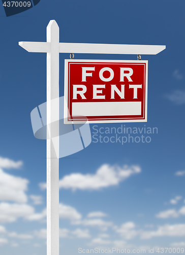 Image of Right Facing For Rent Real Estate Sign on a Blue Sky with Clouds