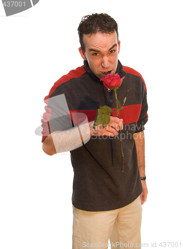 Image of Man Smelling a Rose