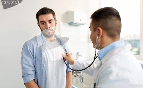 Image of doctor with stethoscope and patient at hospital