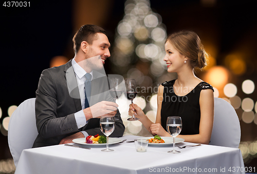 Image of couple with non alcoholic wine at christmas
