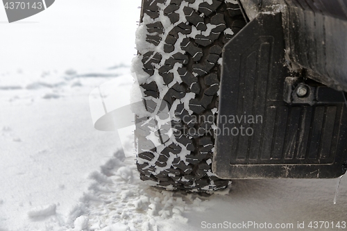 Image of Car tyre in snow