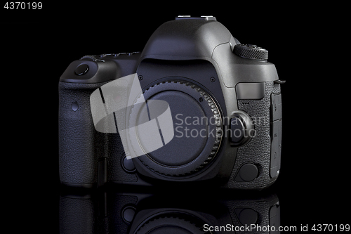 Image of DSLR camera on black glass background