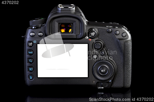 Image of DSLR camera on black glass background