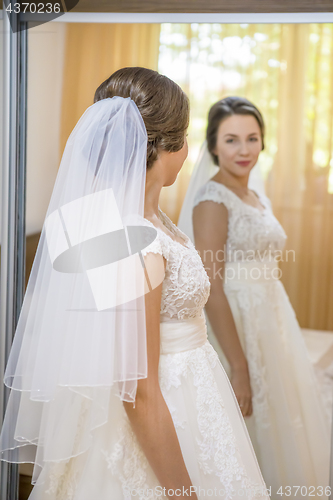 Image of Beautiful young bride in wedding dress