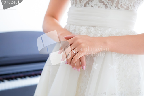 Image of Engagement ring on bride’s finger