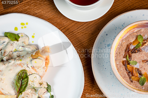 Image of closeup of a plate with a typical tortilla de patatas, spanish omelet, on a set table