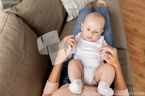 Image of mother with little baby boy at home