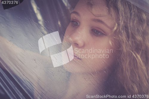 Image of Portrait of a young sad girl.