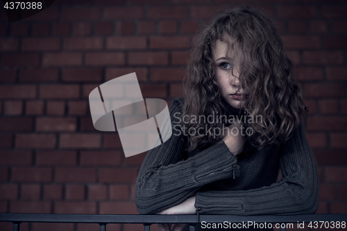 Image of Portrait of a young sad girl.