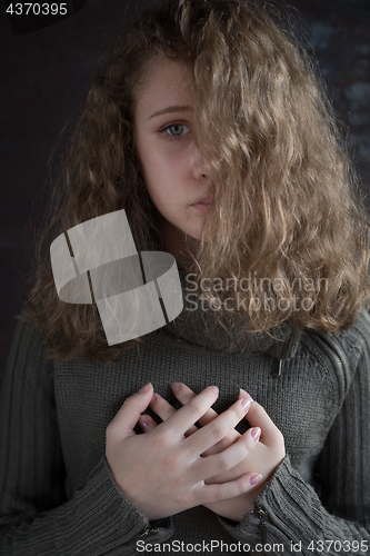 Image of Portrait of a young sad girl.