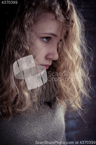 Image of Portrait of a young sad girl.