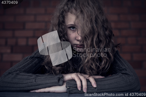 Image of Portrait of a young sad girl.