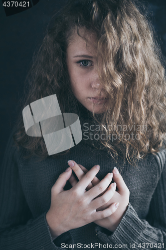 Image of Portrait of a young sad girl.