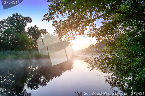 Image of Morning fog on calm river