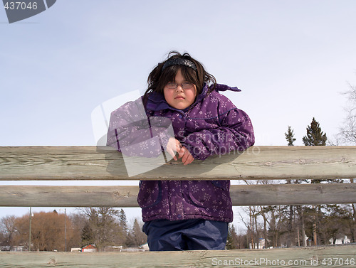 Image of Girl Posing On A Wooden Bridge