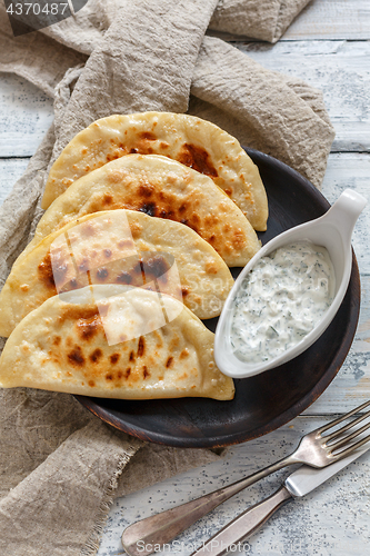 Image of Flat bread with pumpkin filling. Azerbaijani cuisine.