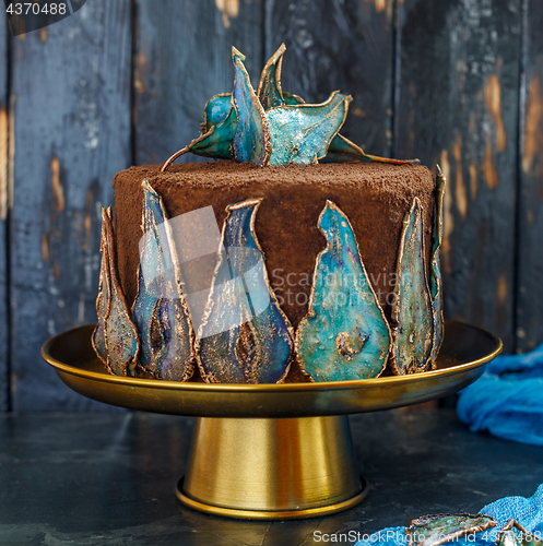 Image of Chocolate cake with dried pears decoration.