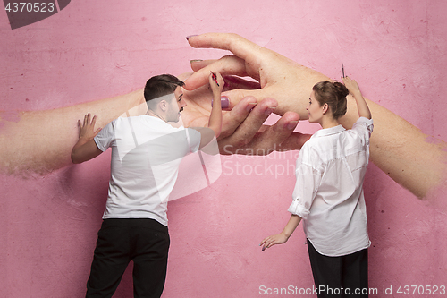 Image of The collage about couple writing something on a pink wall