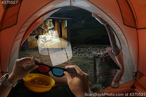 Image of View from the tourist tent to the screen with a gangster movie