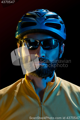 Image of The bicyclist on black, studio shot.