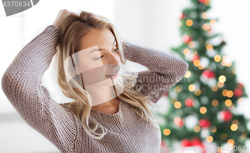 Image of happy young woman or teenage girl at christmas