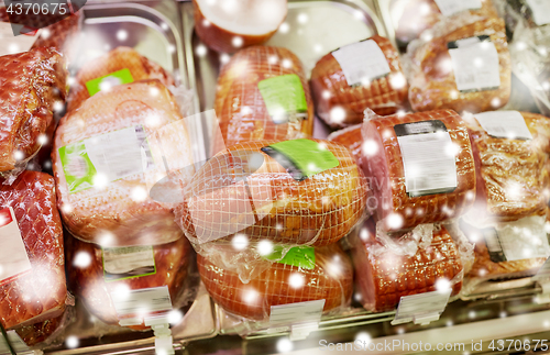 Image of ham at grocery store stall