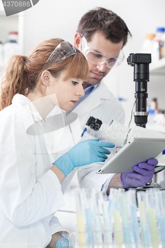 Image of Health care researchers working in scientific laboratory.