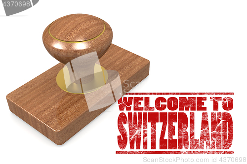 Image of Red rubber stamp with welcome to Switzerland