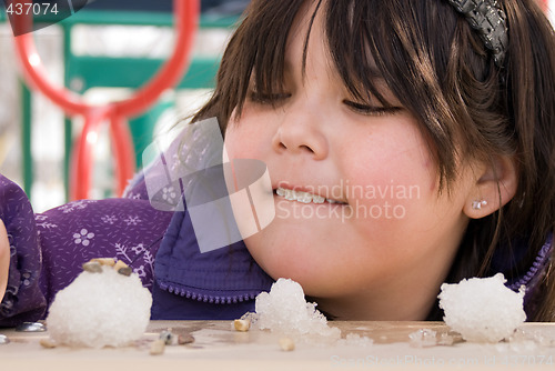 Image of Girl Playing With Snow