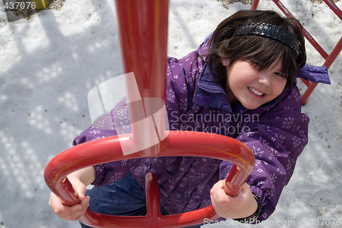 Image of Girl Climbing Playground Equipment