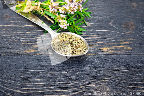 Image of Thyme dry in spoon on black board