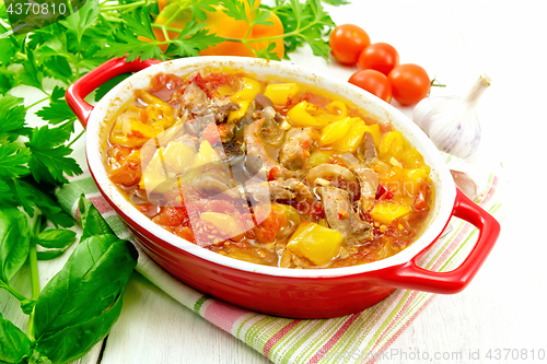 Image of Ragout of meat and vegetables in brazier on napkin