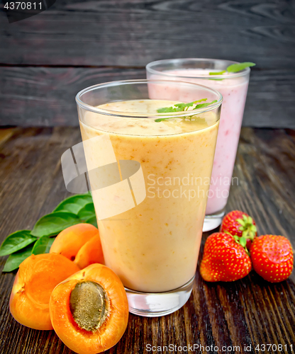 Image of Milkshake apricot and strawberry in glassfulls on board