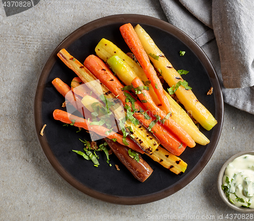 Image of plate of grilled colorful carrots