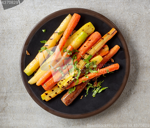 Image of plate of grilled colorful carrots