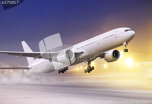 Image of white plane in winter blizzard 